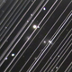 A group of galaxies imaged by a telescope at Lowell Observatory in Arizona on May 25, 2019—just two days after SpaceX deployed 60 Starlink satellites. The diagonal lines running across the image are trails of reflected light left by more than 25 of the satellites as they passed through the telescope’s field of view. Mercifully, the satellites are drifting apart, but scenes like this could become the new normal.
